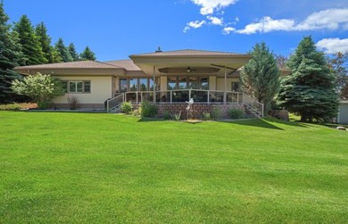 No practice swings here, this lightly lived in and lovingly on Eagle Bend Golf Course in Montana - for sale on GolfHomes.com, golf home, golf lot