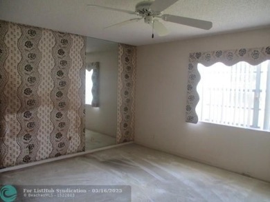 Spacious 2-Bedroom, 2-Bath Unit with Serene Golf Course Views! on Woodmont Country Club in Florida - for sale on GolfHomes.com, golf home, golf lot