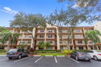 SPACIOUS UNIT WITH ACCORDIAN SHUTTERS AND A SCREENED BALCONY on Flamingo Lakes Country Club in Florida - for sale on GolfHomes.com, golf home, golf lot