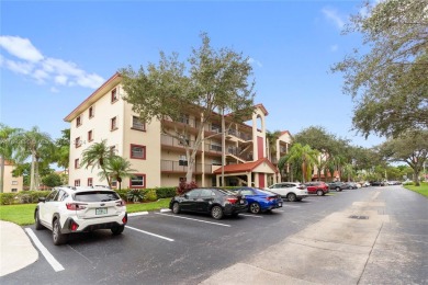 SPACIOUS UNIT WITH ACCORDIAN SHUTTERS AND A SCREENED BALCONY on Flamingo Lakes Country Club in Florida - for sale on GolfHomes.com, golf home, golf lot