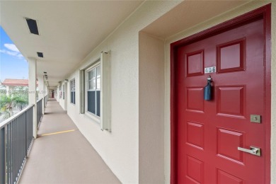 SPACIOUS UNIT WITH ACCORDIAN SHUTTERS AND A SCREENED BALCONY on Flamingo Lakes Country Club in Florida - for sale on GolfHomes.com, golf home, golf lot