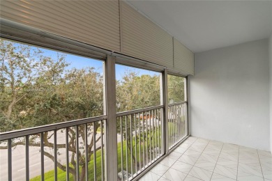 SPACIOUS UNIT WITH ACCORDIAN SHUTTERS AND A SCREENED BALCONY on Flamingo Lakes Country Club in Florida - for sale on GolfHomes.com, golf home, golf lot