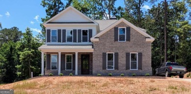 A golfer's paradise! This 4-bedroom, 3-bathroom home with 9' on Indian Creek Golf Club in Georgia - for sale on GolfHomes.com, golf home, golf lot