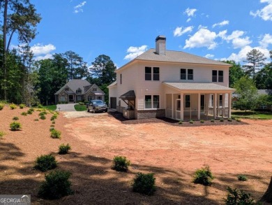 A golfer's paradise! This 4-bedroom, 3-bathroom home with 9' on Indian Creek Golf Club in Georgia - for sale on GolfHomes.com, golf home, golf lot