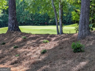 A golfer's paradise! This 4-bedroom, 3-bathroom home with 9' on Indian Creek Golf Club in Georgia - for sale on GolfHomes.com, golf home, golf lot