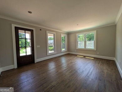 A golfer's paradise! This 4-bedroom, 3-bathroom home with 9' on Indian Creek Golf Club in Georgia - for sale on GolfHomes.com, golf home, golf lot