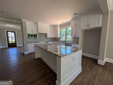 A golfer's paradise! This 4-bedroom, 3-bathroom home with 9' on Indian Creek Golf Club in Georgia - for sale on GolfHomes.com, golf home, golf lot