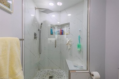 Rarely available end-unit condo with attached garage offering on Imperial Golf Club in Florida - for sale on GolfHomes.com, golf home, golf lot