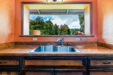 This recently remodeled two bedroom, two bath cabin is a on Volcano Golf and Country Club in Hawaii - for sale on GolfHomes.com, golf home, golf lot