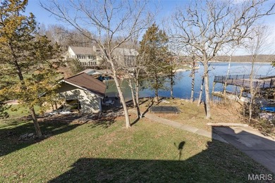 Welcome to the lake! This one is a turnkey waterfront lake house on Raintree Country Club in Missouri - for sale on GolfHomes.com, golf home, golf lot