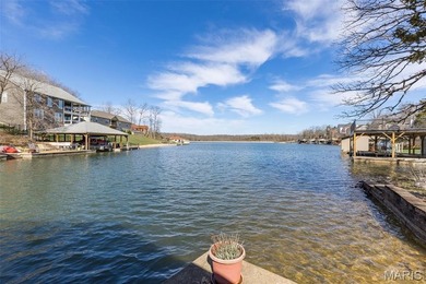 Welcome to the lake! This one is a turnkey waterfront lake house on Raintree Country Club in Missouri - for sale on GolfHomes.com, golf home, golf lot