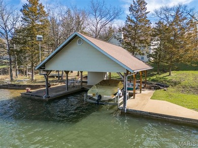 Welcome to the lake! This one is a turnkey waterfront lake house on Raintree Country Club in Missouri - for sale on GolfHomes.com, golf home, golf lot