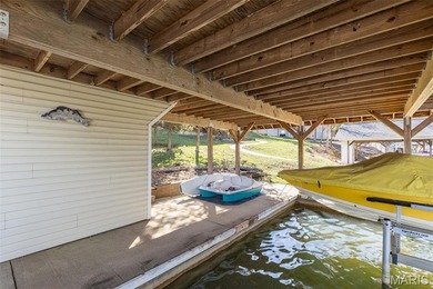 Welcome to the lake! This one is a turnkey waterfront lake house on Raintree Country Club in Missouri - for sale on GolfHomes.com, golf home, golf lot