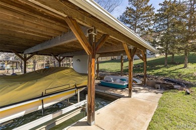 Welcome to the lake! This one is a turnkey waterfront lake house on Raintree Country Club in Missouri - for sale on GolfHomes.com, golf home, golf lot