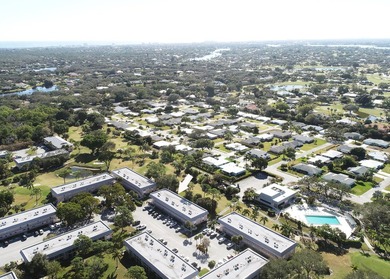 Freshly painted 2/1.5 second floor condo in the 55+ community of on The Little Club in Florida - for sale on GolfHomes.com, golf home, golf lot
