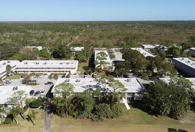 Freshly painted 2/1.5 second floor condo in the 55+ community of on The Little Club in Florida - for sale on GolfHomes.com, golf home, golf lot