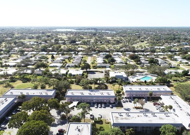 Freshly painted 2/1.5 second floor condo in the 55+ community of on The Little Club in Florida - for sale on GolfHomes.com, golf home, golf lot