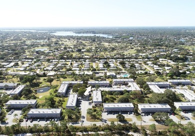 Freshly painted 2/1.5 second floor condo in the 55+ community of on The Little Club in Florida - for sale on GolfHomes.com, golf home, golf lot