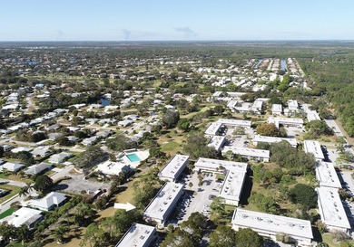 Freshly painted 2/1.5 second floor condo in the 55+ community of on The Little Club in Florida - for sale on GolfHomes.com, golf home, golf lot
