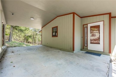 This lake view home on Table Rock Lake is perfect for those who on Holiday Island Executive Golf Course in Arkansas - for sale on GolfHomes.com, golf home, golf lot