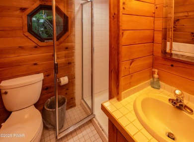 Privately set Lakefront Retreat with three levels of abundant on Lords Valley Country Club, Inc in Pennsylvania - for sale on GolfHomes.com, golf home, golf lot