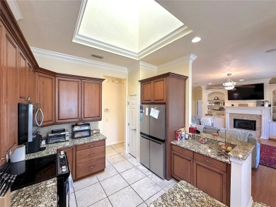 This beautiful Tommy Waters home is ideally located walking on Haile Plantation Golf and Country Club in Florida - for sale on GolfHomes.com, golf home, golf lot