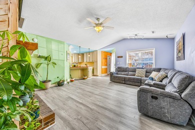 This inviting single-level three-bedroom, two-bath beach home is on Whispering Pines in South Carolina - for sale on GolfHomes.com, golf home, golf lot