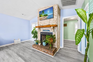 This inviting single-level three-bedroom, two-bath beach home is on Whispering Pines in South Carolina - for sale on GolfHomes.com, golf home, golf lot