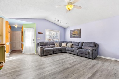 This inviting single-level three-bedroom, two-bath beach home is on Whispering Pines in South Carolina - for sale on GolfHomes.com, golf home, golf lot