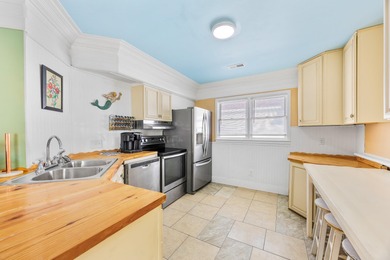 This inviting single-level three-bedroom, two-bath beach home is on Whispering Pines in South Carolina - for sale on GolfHomes.com, golf home, golf lot