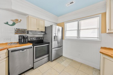 This inviting single-level three-bedroom, two-bath beach home is on Whispering Pines in South Carolina - for sale on GolfHomes.com, golf home, golf lot