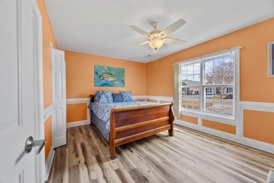 This inviting single-level three-bedroom, two-bath beach home is on Whispering Pines in South Carolina - for sale on GolfHomes.com, golf home, golf lot