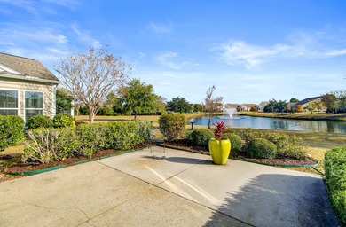 Pond living in this spacious, turn-key home in Del Webb Cane Bay on Cypress Point Par 3 in South Carolina - for sale on GolfHomes.com, golf home, golf lot
