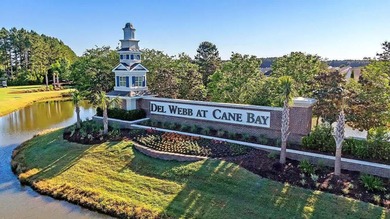 Pond living in this spacious, turn-key home in Del Webb Cane Bay on Cypress Point Par 3 in South Carolina - for sale on GolfHomes.com, golf home, golf lot