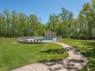 Nestled on prestigious Abbey Road, 1032 offers a luxurious on Carrington Golf Club in Michigan - for sale on GolfHomes.com, golf home, golf lot