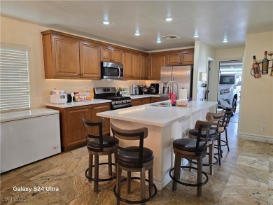 Discover this stunning two-story home nestled in the prestigious on Rhodes Ranch Golf Club in Nevada - for sale on GolfHomes.com, golf home, golf lot