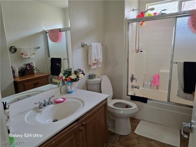 Discover this stunning two-story home nestled in the prestigious on Rhodes Ranch Golf Club in Nevada - for sale on GolfHomes.com, golf home, golf lot