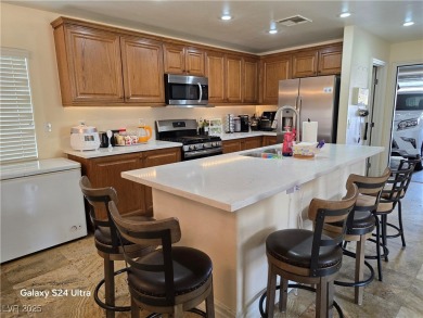Discover this stunning two-story home nestled in the prestigious on Rhodes Ranch Golf Club in Nevada - for sale on GolfHomes.com, golf home, golf lot