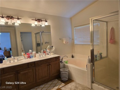 Discover this stunning two-story home nestled in the prestigious on Rhodes Ranch Golf Club in Nevada - for sale on GolfHomes.com, golf home, golf lot