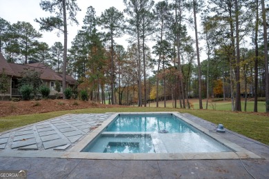 This meticulous custom golf residence is impeccably built with on Reynolds Lake Oconee - The Oconee in Georgia - for sale on GolfHomes.com, golf home, golf lot