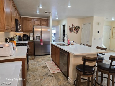 Discover this stunning two-story home nestled in the prestigious on Rhodes Ranch Golf Club in Nevada - for sale on GolfHomes.com, golf home, golf lot