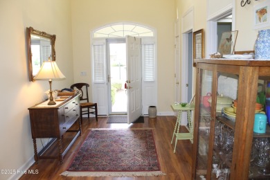 YOU WILL DISCOVER TRANQUIL POND VIEWS & COASTAL COMFORT IN THIS on Ocean Ridge Plantation in North Carolina - for sale on GolfHomes.com, golf home, golf lot