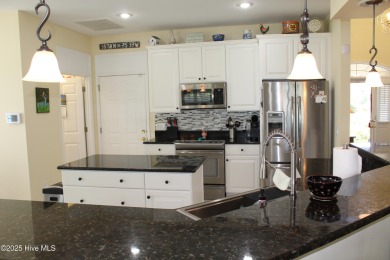 YOU WILL DISCOVER TRANQUIL POND VIEWS & COASTAL COMFORT IN THIS on Ocean Ridge Plantation in North Carolina - for sale on GolfHomes.com, golf home, golf lot
