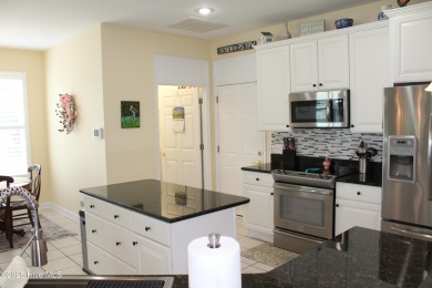 YOU WILL DISCOVER TRANQUIL POND VIEWS & COASTAL COMFORT IN THIS on Ocean Ridge Plantation in North Carolina - for sale on GolfHomes.com, golf home, golf lot