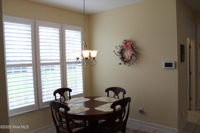 YOU WILL DISCOVER TRANQUIL POND VIEWS & COASTAL COMFORT IN THIS on Ocean Ridge Plantation in North Carolina - for sale on GolfHomes.com, golf home, golf lot