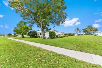 BRAND NEW METAL ROOF! Welcome to this beautiful Challenger model on Leisureville Community Golf Course in Florida - for sale on GolfHomes.com, golf home, golf lot