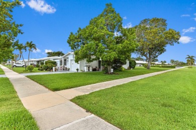 BRAND NEW METAL ROOF! Welcome to this beautiful Challenger model on Leisureville Community Golf Course in Florida - for sale on GolfHomes.com, golf home, golf lot