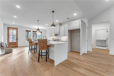 Open  floor plan with beamed vaulted ceiling. The split floor on Bella Vista - Metfield Golf Complex and Country Club in Arkansas - for sale on GolfHomes.com, golf home, golf lot