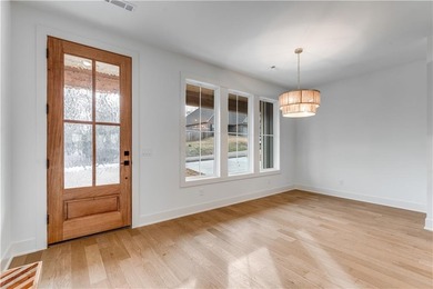 Open  floor plan with beamed vaulted ceiling. The split floor on Bella Vista - Metfield Golf Complex and Country Club in Arkansas - for sale on GolfHomes.com, golf home, golf lot