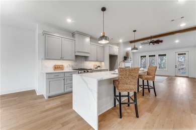 Open  floor plan with beamed vaulted ceiling. The split floor on Bella Vista - Metfield Golf Complex and Country Club in Arkansas - for sale on GolfHomes.com, golf home, golf lot